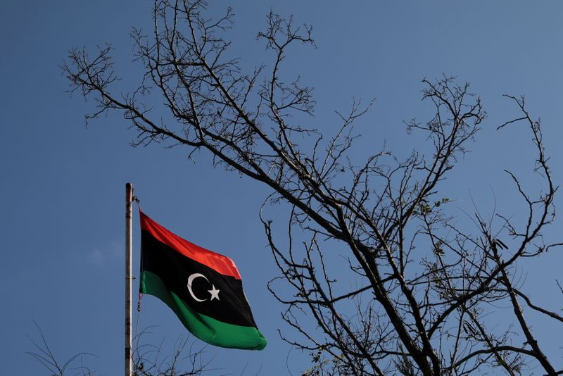 FILE PHOTO: A Libyan flag flutters atop the Libyan Consulate