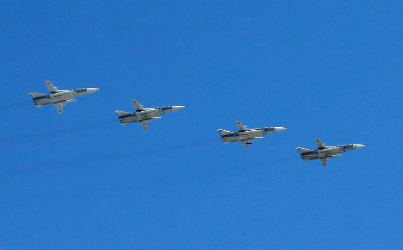Su-24M front-line bombers fly in formation during Victory Day parade