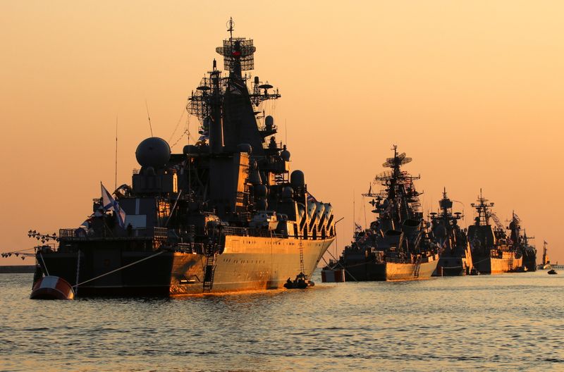 FILE PHOTO: A view shows Russian warships on sunset ahead
