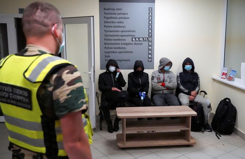 Lithuanian border guards detain migrants illegally crossing the border from