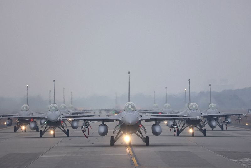 12 F-16V fighter jets perform an elephant walk during an