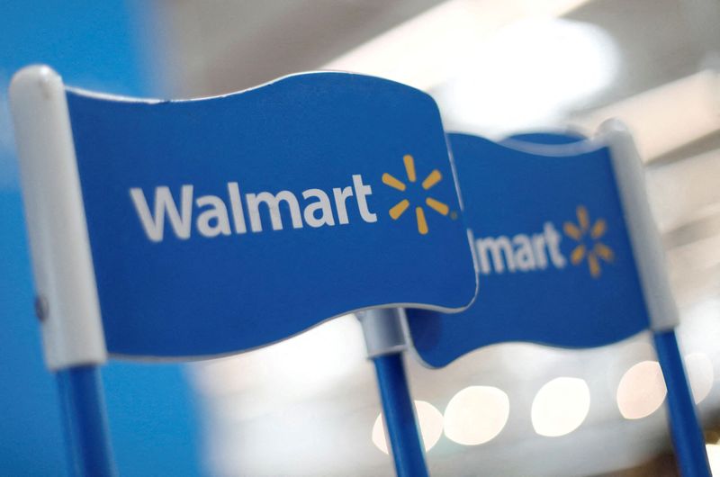 FILE PHOTO: Walmart signs are displayed inside a Walmart store
