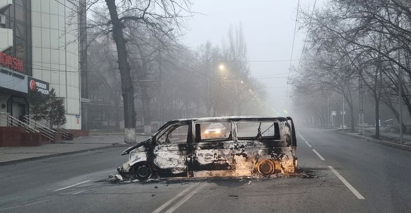 A vehicle that was burned during the protests is seen