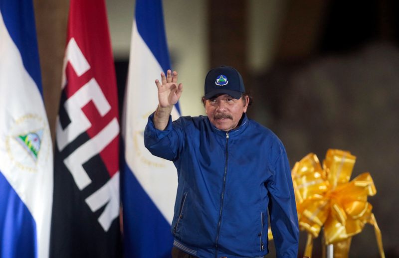 Nicaraguan President Daniel Ortega greets supporters during the opening ceremony