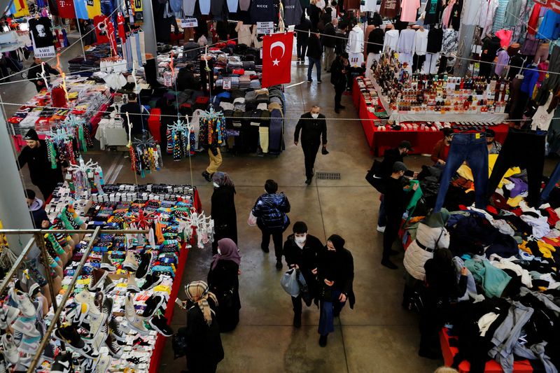 FILE PHOTO: People shop at an open market in Istanbul