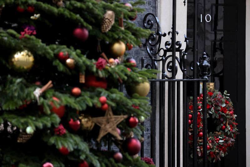 The door of 10 Downing Street is decorated with Christmas