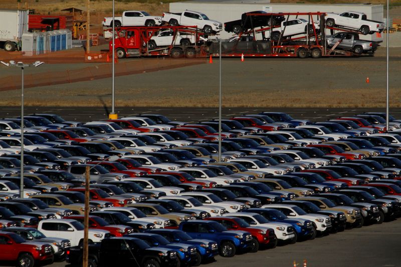 Newly assembled vehicles are seen at a stockyard of the
