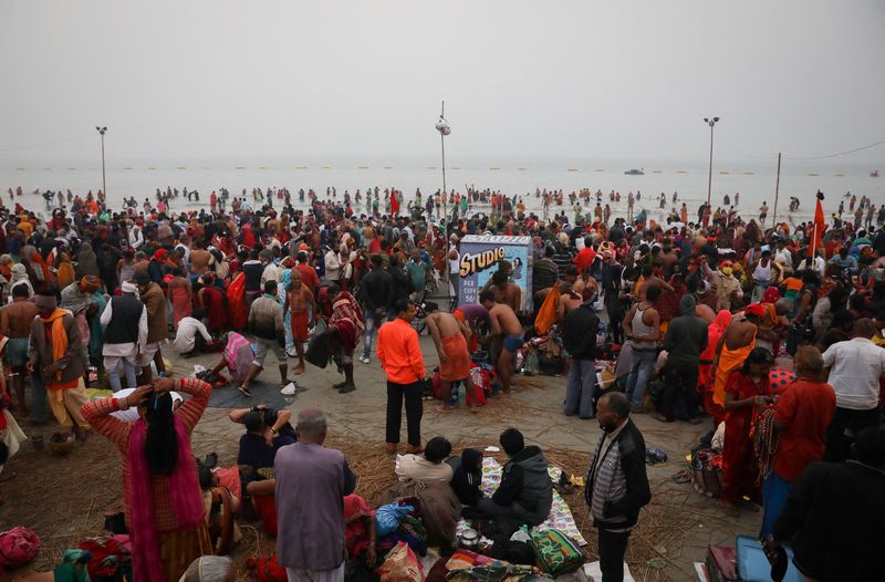 Hindu pilgrims gather at the confluence of the river Ganges