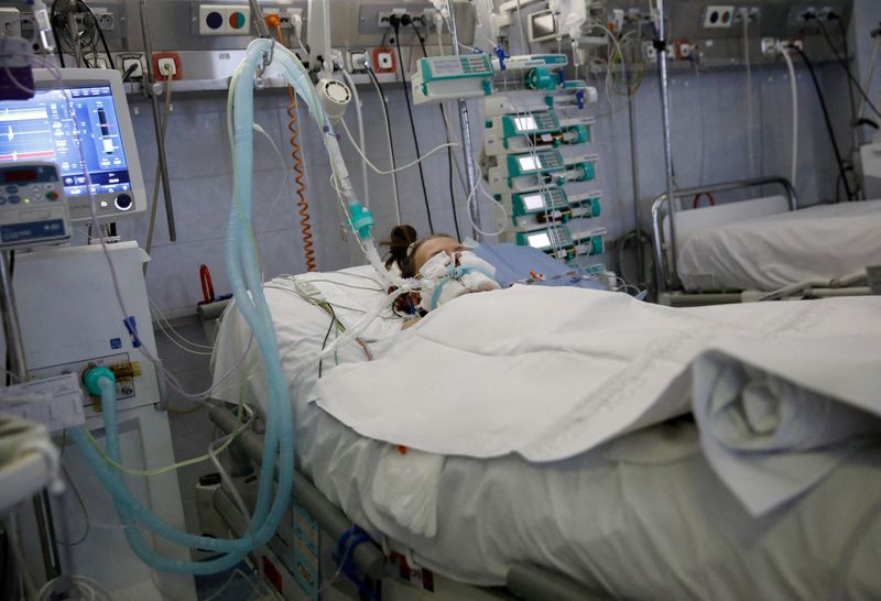 FILE PHOTO: A patient lies intubated on the coronavirus disease