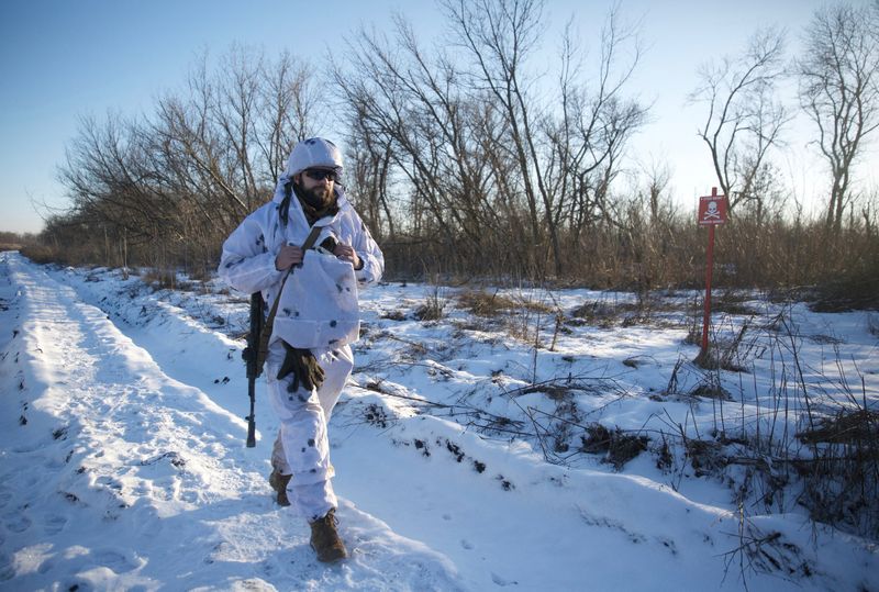 A service member of the Ukrainian armed forces walks at