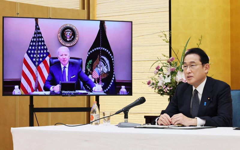 Japan’s Prime Minister Fumio Kishida attends a virtual meeting with