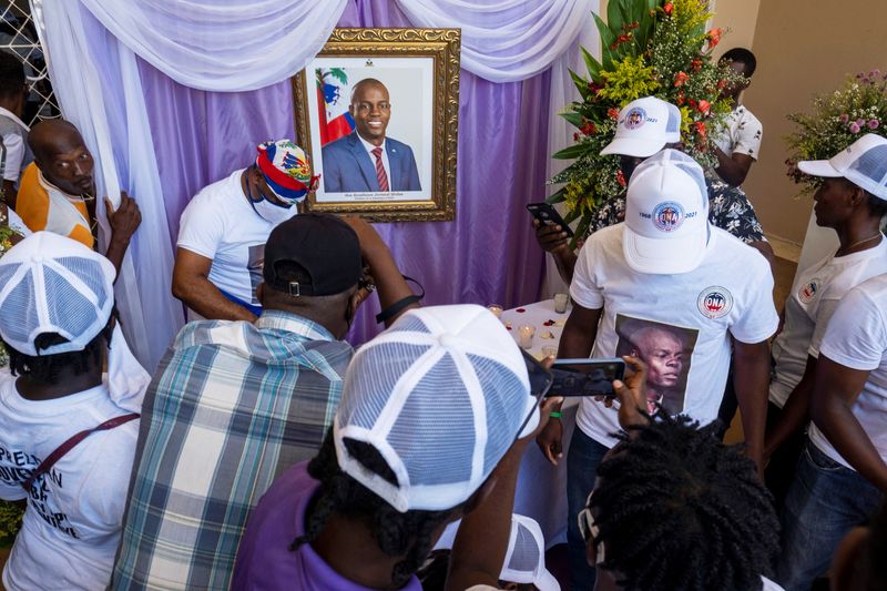 People attend a memorial for slain Haitian President Jovenel Moise