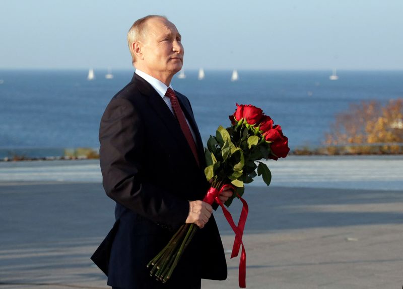 Russia’s President Vladimir Putin visits a monument on Unity Day
