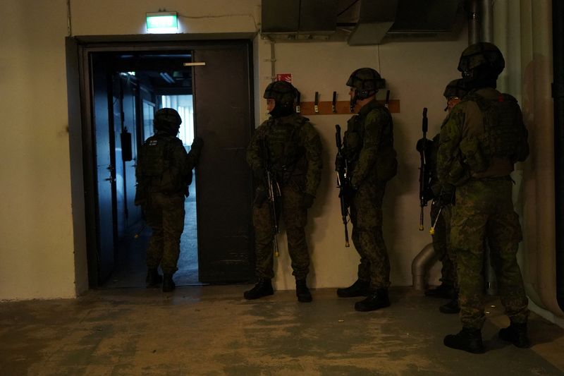 Finnish military police officers take part in a security drill
