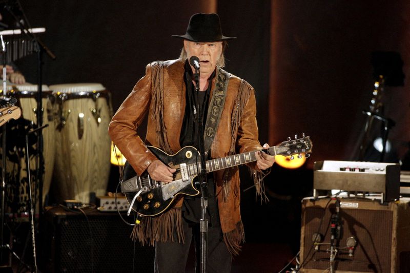 FILE PHOTO: Singer/songwriter Neil Young performs during a concert honoring