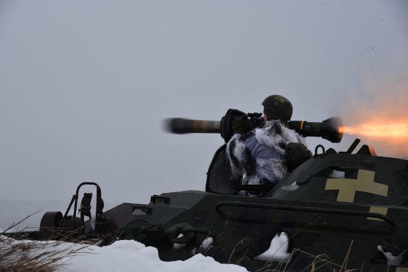 Ukrainian service members use NLAW missiles during drills in the