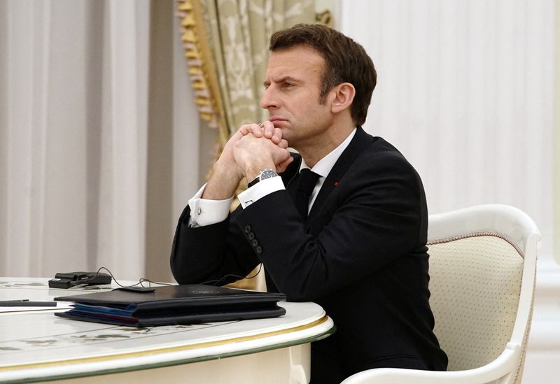 Russian President Vladimir Putin meets with French President Emmanuel Macron