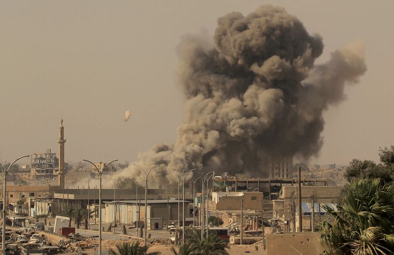 FILE PHOTO: Smoke rises after an air strike during fighting