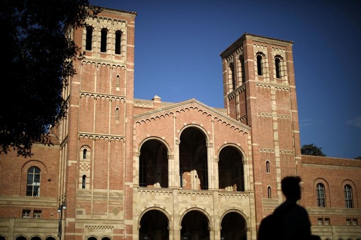A student walks past Royce Hall on the University of