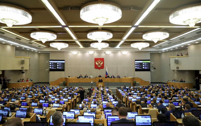 FILE PHOTO: Russian parliamentarians attend a session of the State