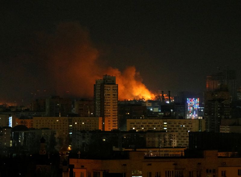Smoke and flames rise over during the shelling near Kyiv
