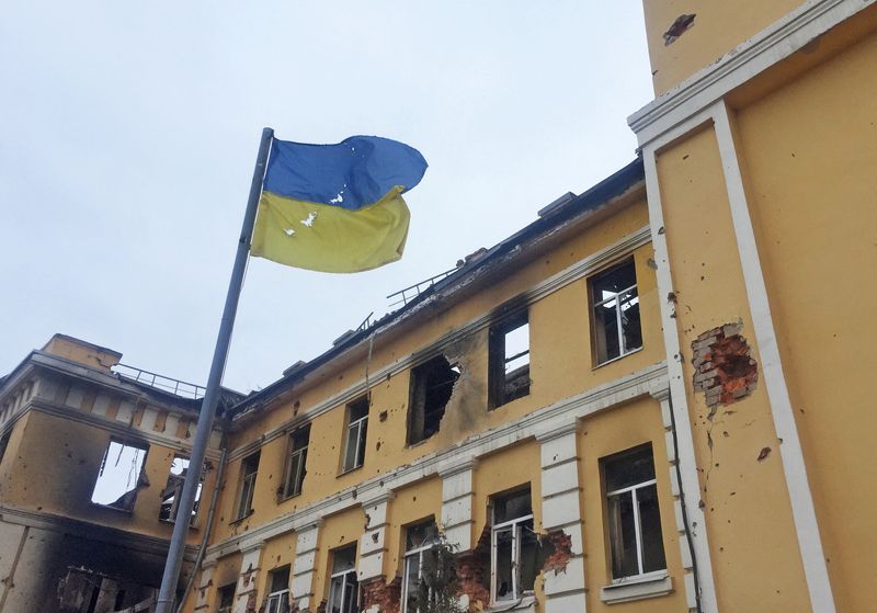 The Ukrainian national flag is seen in front of a