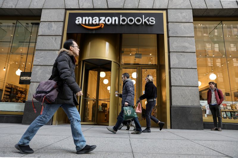 People walk past an Amazon Books retail store in New
