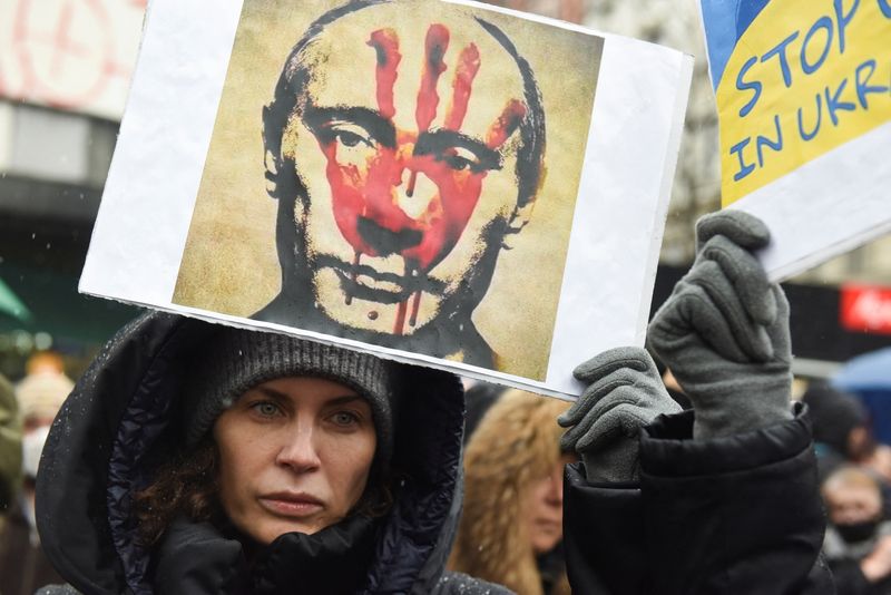 People take part in an anti-war protest, following Russia’s invasion