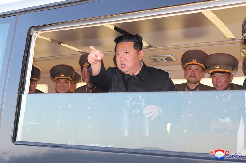 FILE PHOTO: North Korean leader Kim Jong Un observes new