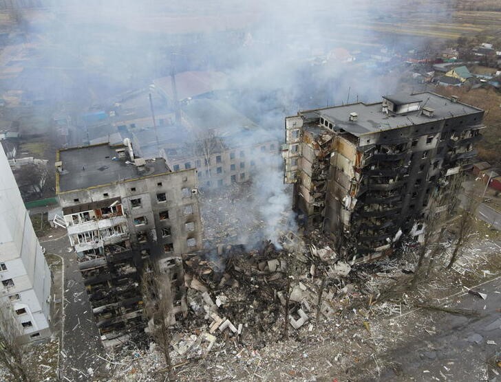 An aerial view shows a residential building destroyed by shelling