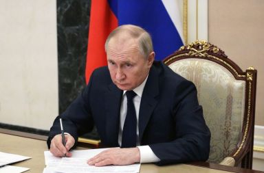 Russian President Vladimir Putin attends a meeting with government members