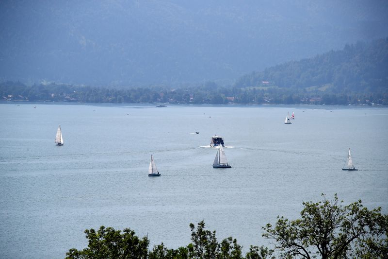 FILE PHOTO: Boats cruise on lake Tegernsee during a hot,