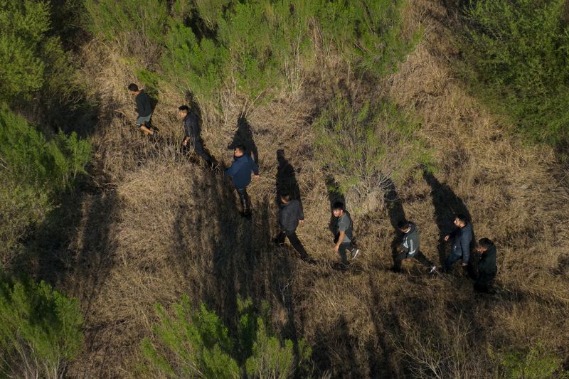 Migrants race north after crossing into U.S. from Mexico in