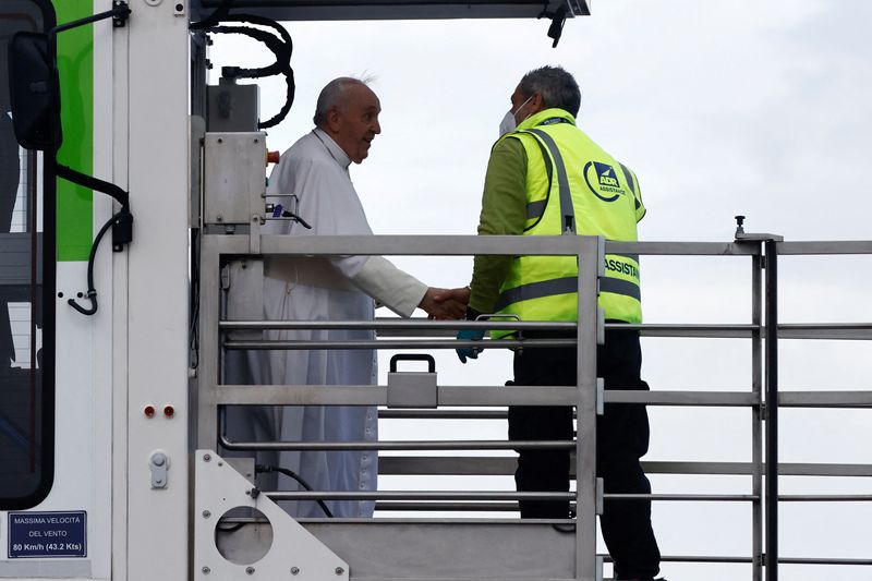 Pope Francis arrives to board a plane for his visit