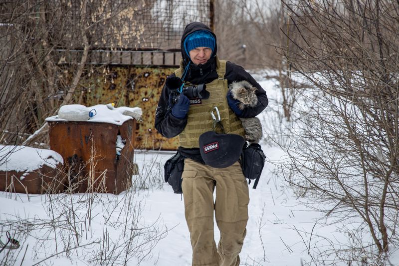 FILE PHOTO: Ukrainian photographer Maksim Levin near the line of