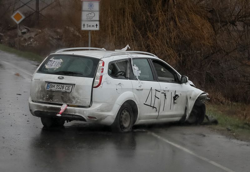 A shot car with inscriptions “Children” is seen on the
