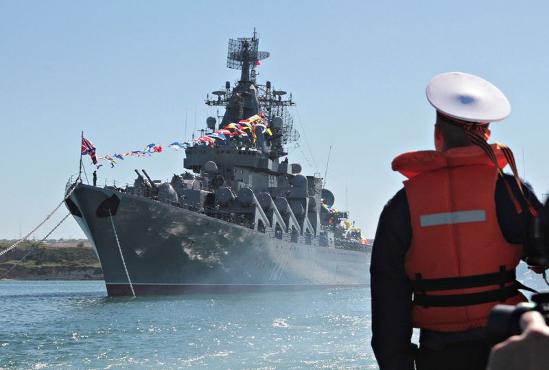 FILE PHOTO: A sailor looks at the Russian missile cruiser