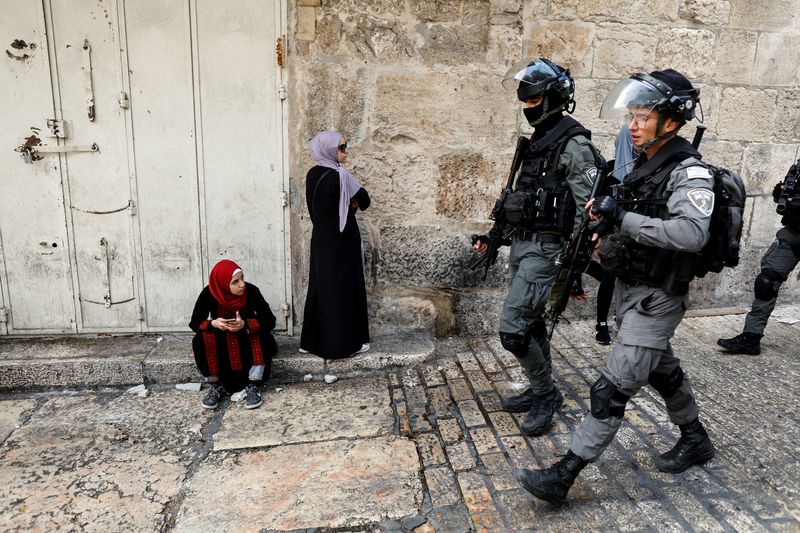 Israeli security personnel patrol an ally in Jerusalem’s Old City