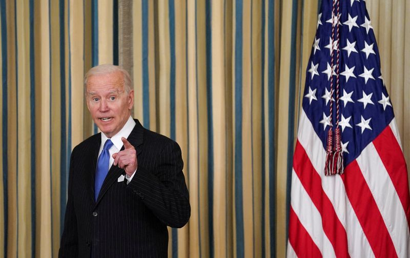 FILE PHOTO: Biden signs Postal Service Reform Act in Washington
