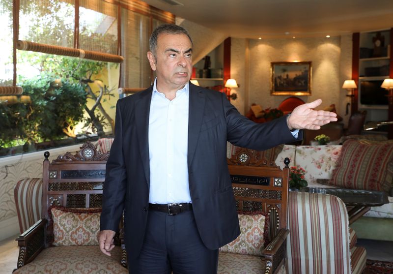Fugitive former car executive Carlos Ghosn, gestures before an interview