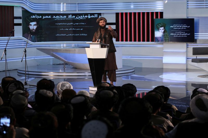 Taliban spokesman Zabihullah Mujahid speaks during the death anniversary of
