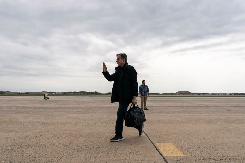 U.S. Secretary of State Antony Blinken waves as he departs