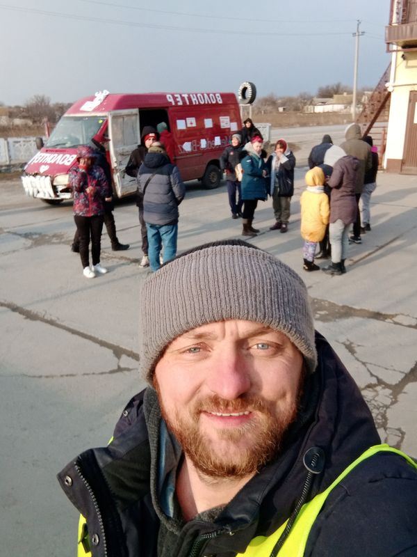 Mykhailo Puryshev poses for a selfie photo in front of