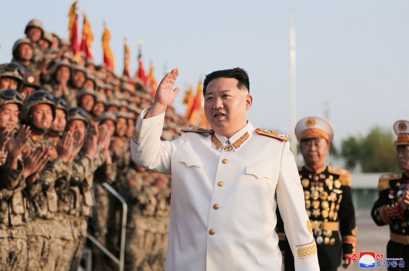 North Korean leader Kim Jong Un meets troops who have