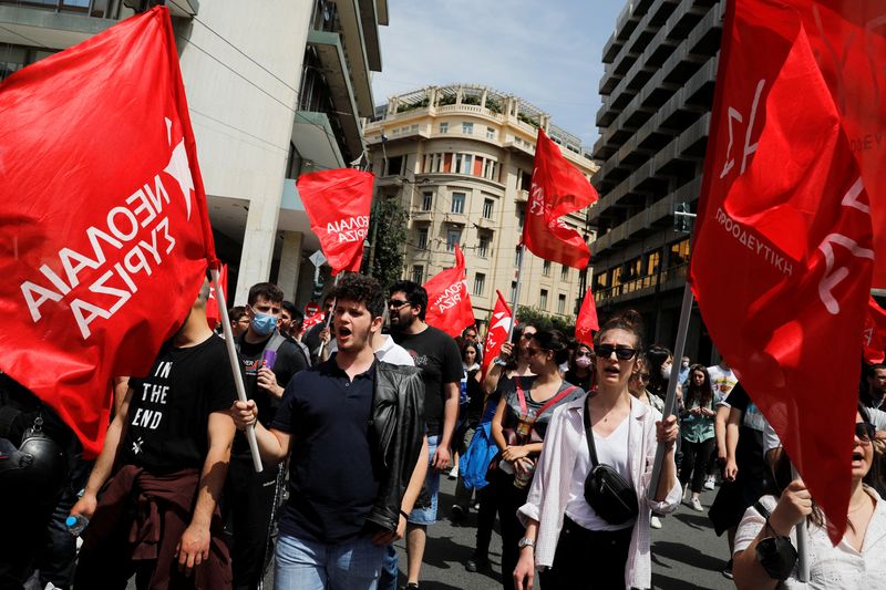 Protesters take part in a rally commemorating May Day in