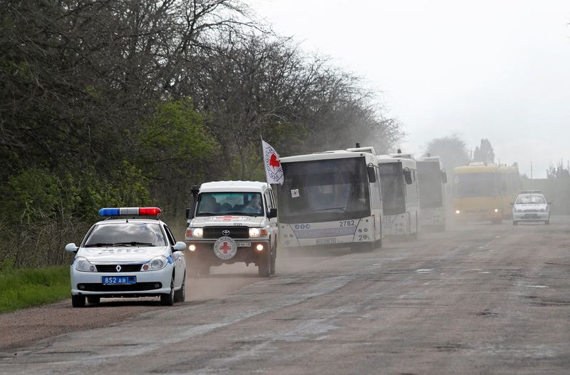 A convoy carrying evacuees from Mariupol area is seen on