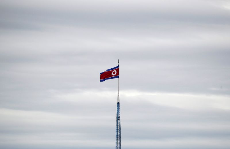 FILE PHOTO: A North Korean flag flutters on top of