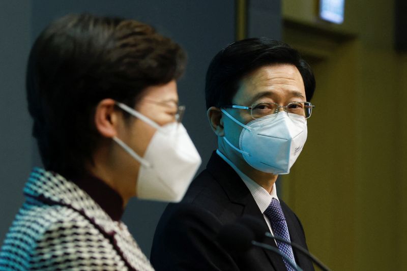 FILE PHOTO: Hong Kong Chief Executive Carrie Lam holds a