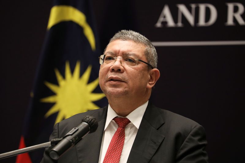 Malaysia’s Foreign Minister Saifuddin Abdullah speaks during a news conference