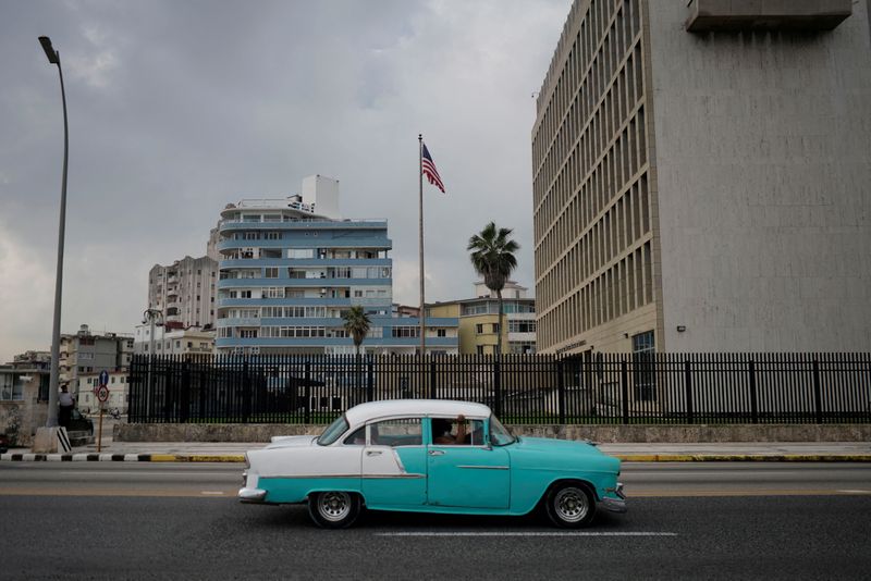 FILE PHOTO: A vintage car passes by the U.S. Embassy